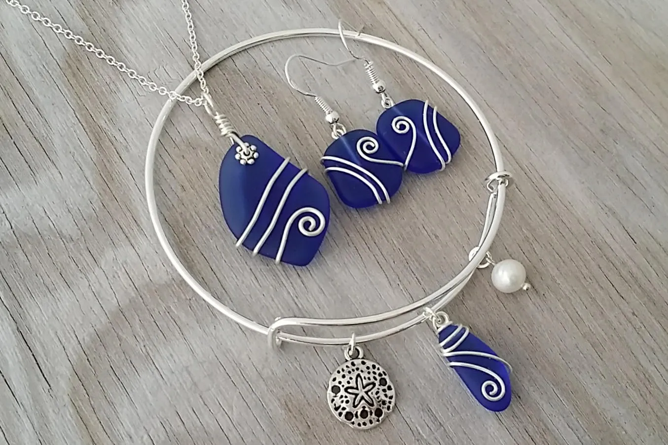 Handmade in Hawaii, Wire wrapped cobalt blue sea glass necklace   earrings   bracelet set, Sand dollar, "September Birthstone"