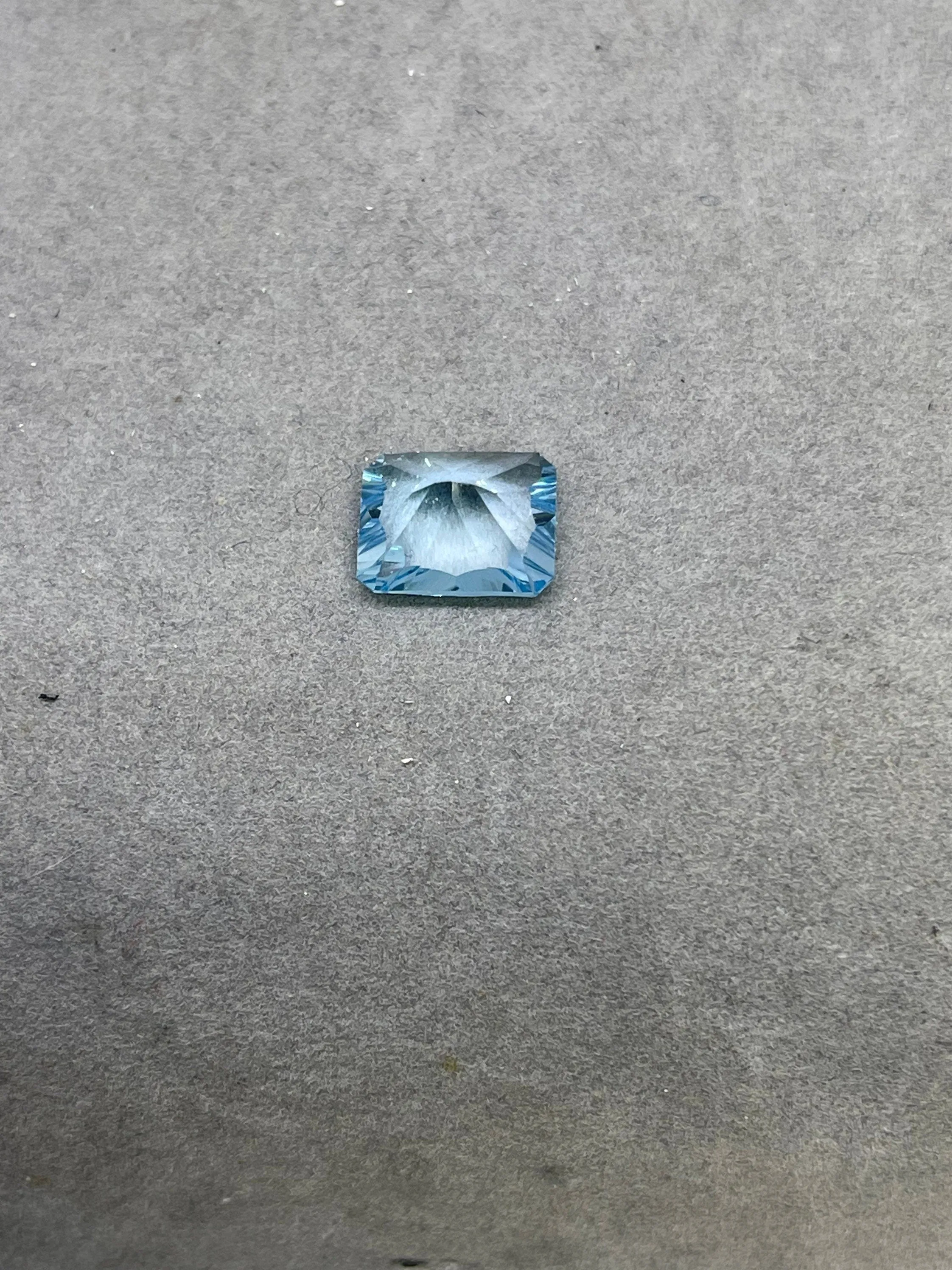 Laser Concave Cut Swiss Blue Topaz 12x10x7 Emerald Cut Loose Gemstone