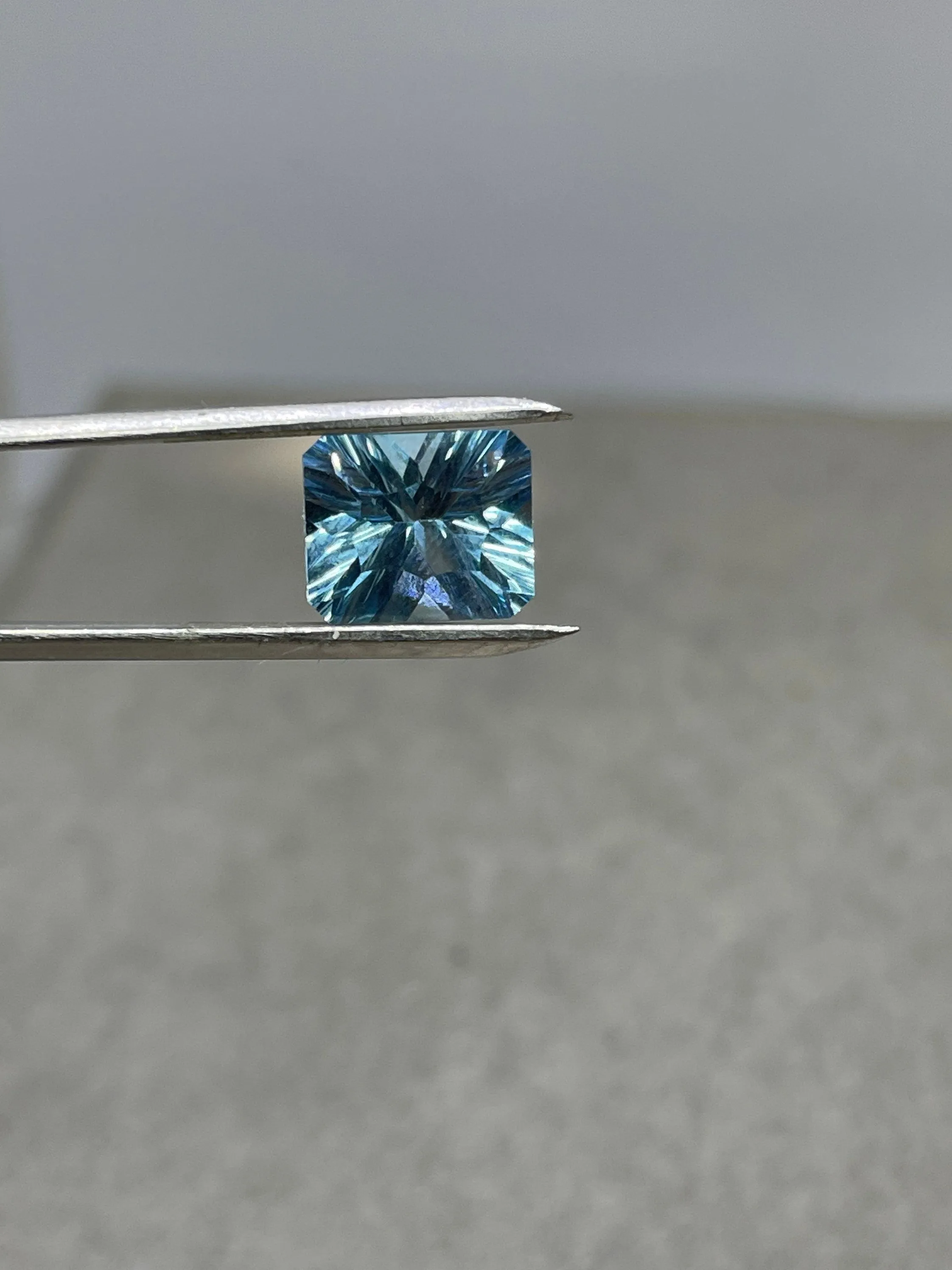 Laser Concave Cut Swiss Blue Topaz 12x10x7 Emerald Cut Loose Gemstone