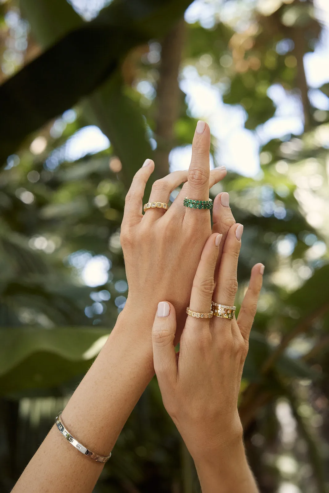Round Emerald Eternity Band